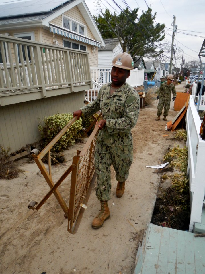 A Seabee removes debris in New York. (8199138403)