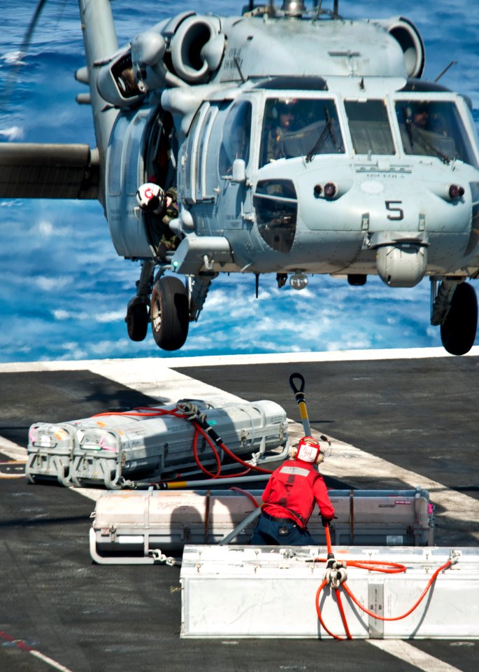 A Sea Hawk helicopter takes supplies to USS Nimitz. (8695666417)