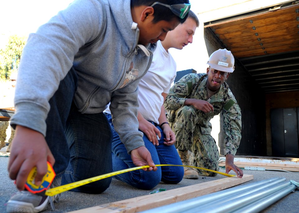 A Seabee mentors high school ROTC students. (8509278357)