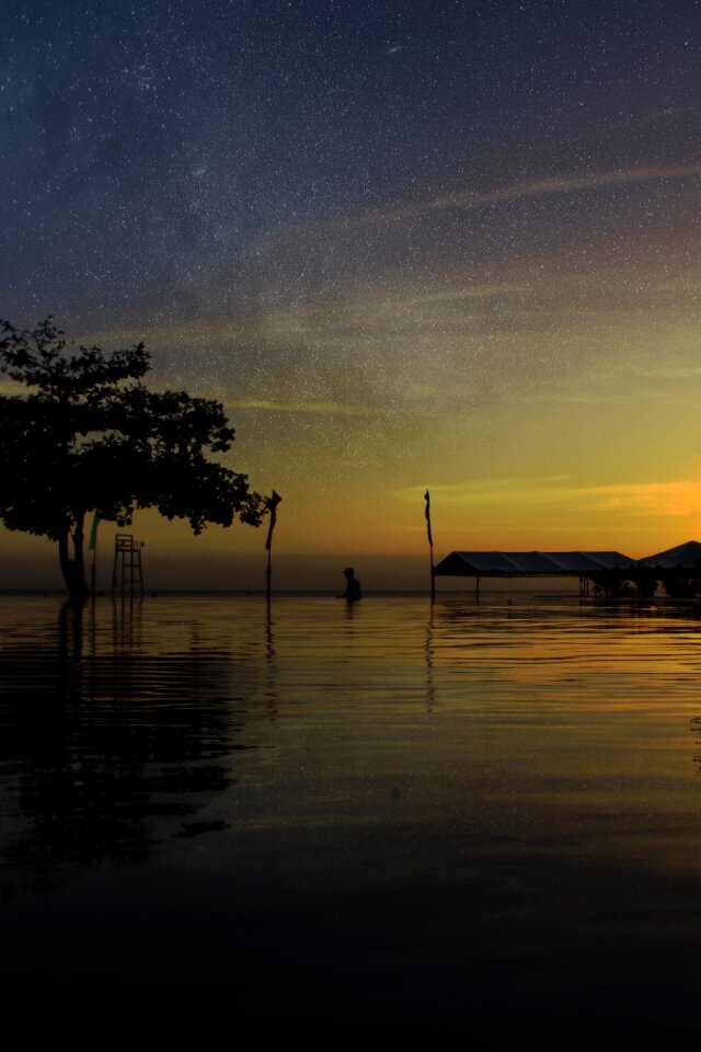 Silhouette sunset reflection