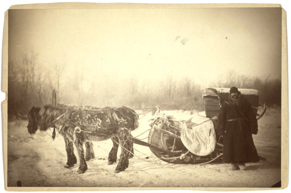 A Siberian posting sledge on a cold morning, with GK (i.e., George Kennan) standing at the right LCCN99615510