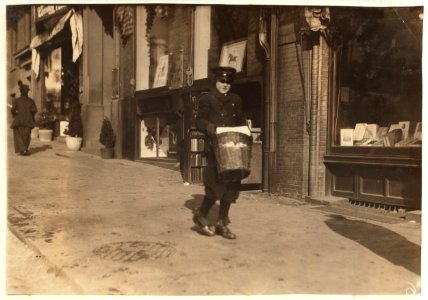 A small messenger with a heavy load. Special delivery messenger -10. Taken in the morning near Common. LOC nclc.03986