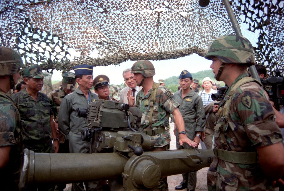 A soldier explains the TOW tube-launched, optically tracked, wire-guided heavy anti-tank weapon to GEN Sundhara Kongsompong, Supreme Commander, Royal Thai Armed Forces, and U.S. Ambassador to Thailand
