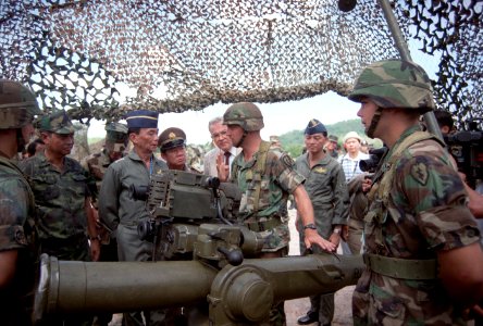 A soldier explains the TOW tube-launched, optically tracked, wire-guided heavy anti-tank weapon to GEN Sundhara Kongsompong, Supreme Commander, Royal Thai Armed Forces, and U.S. Ambassador to Thailand