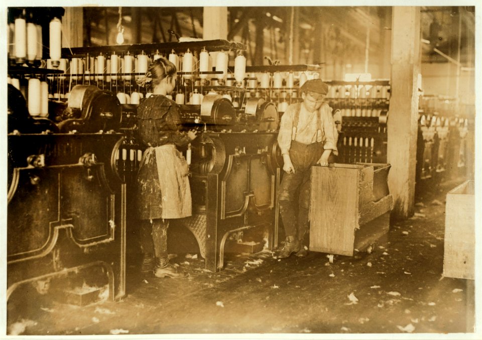 A spinner and a doffer in Catawba Cotton Mill, Newton, N.C. Out of forty employed there were ten almost as small as these. LOC nclc.01559