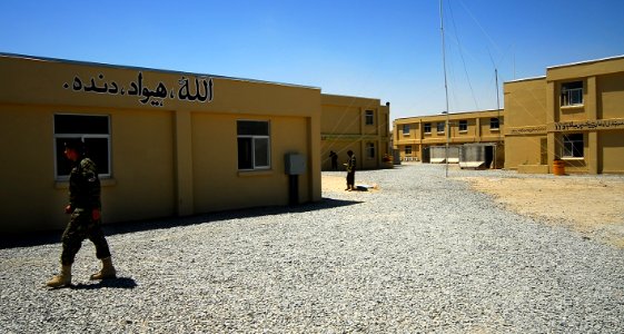A soldier walks the new construction at Kandahar Air Field. (4693228629)