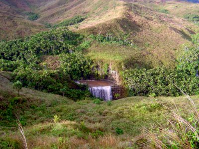 A spring-fed waterfall in the volcanic mountains of Guam (line377972745)