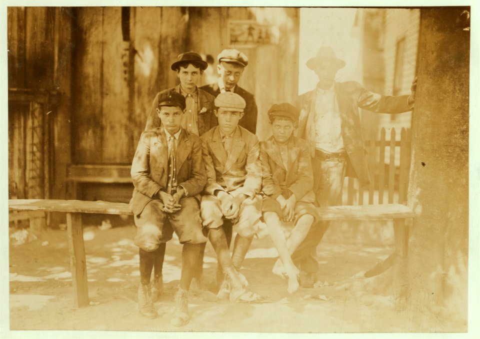 A Sunday hand-out of doffers and other mill fellows. Reputed a bad lot. Smallest boy is Arthur, said he was 13 (doubtful) & been in mill 4 years. Get $3.50 a week now. LOC nclc.02129