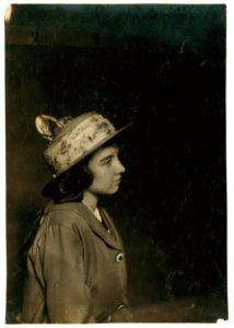 Aldea Balanger - French - Weaver. Cornell Mills - 14 years old July 12, 1915, getting her certificate for her 5th position. Face broken out as most of weavers have from the machine oil, LOC nclc.03067