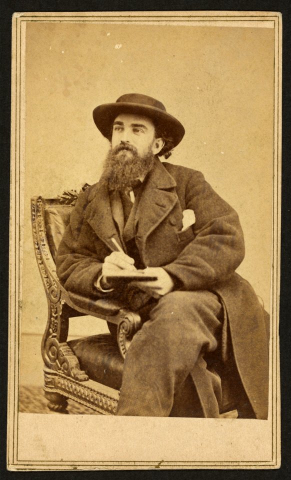 Alfred Waud, full-length portrait, seated, holding a pencil and pad, facing left LCCN2009631311