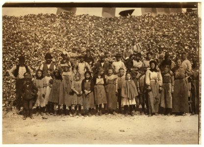 All are oyster shuckers in the Dunbar Cannery. Began work about 3-00 A.M. and worked until about 5-00 P.M. with half an hour for lunch. The great hill of shells is only part of the season's LOC nclc.00914