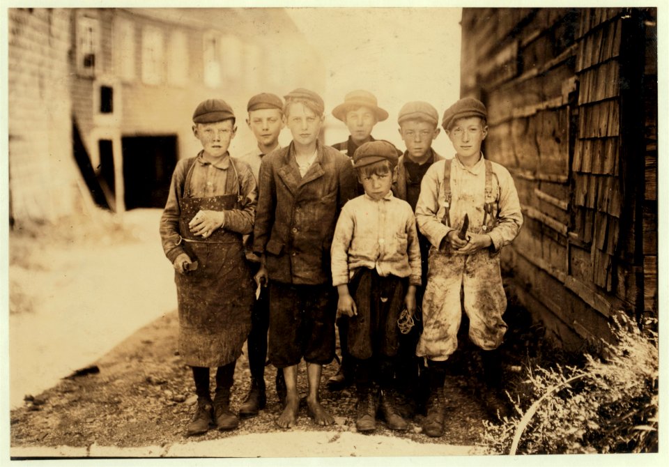 All these boys are cutters in the Seacoast Canning Co., Factory -7. Ages range from 7 to 12. They live near the factory. Seven year old boy in front, Byron Hamilton, has a badly cut finger, LOC cph.3a38912