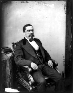 Alonzo Jacob Ransier, Afro-American congressman, three-quarter length portrait, seated by small table, facing right LCCN90705923