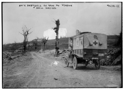 Am'n (i.e. American) Ambulance on road to Verdun, shell bursting LCCN2014703068