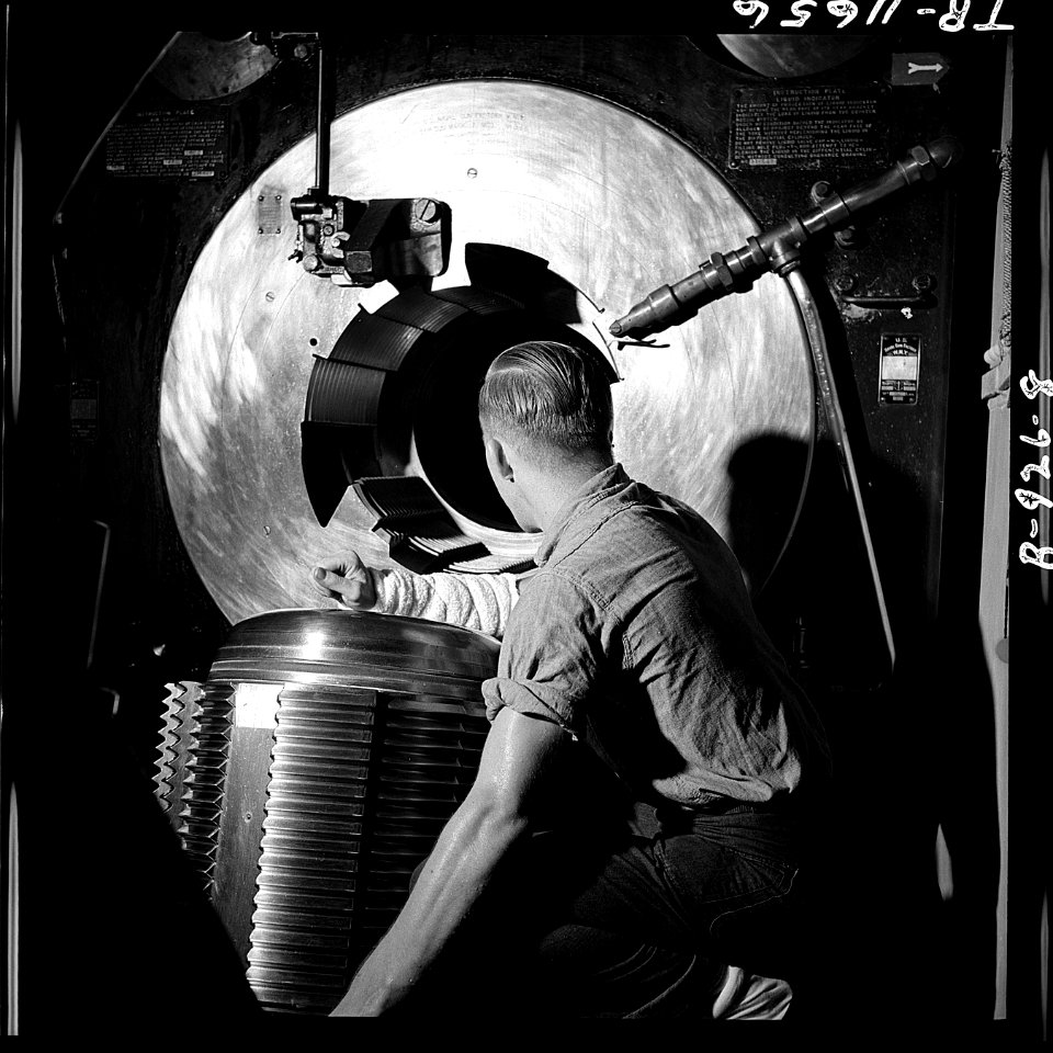 Barbette of 16 gun on board the USS New Jersey (BB-62). Gunner lowers breech block preparatory to loading grant shell. - NARA - 520876