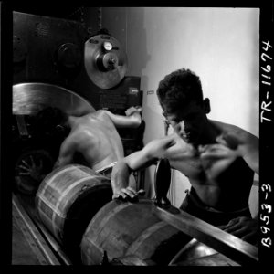 Barbette of 16 gun on board the USS New Jersey (BB-62). Gunners packing in bags of powder which will fire the huge... - NARA - 520877