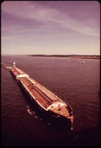 Barge-chugs-eastward-along-the-columbia-river-behind-is-a-fleet-of-small-fishing-boats-051973 4272411568 o