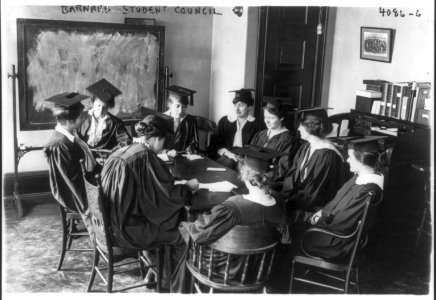 Barnard College student council - seated around table in caps and gowns LCCN2006686899