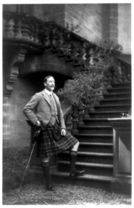 Baron Simon Joseph Fraser Lovat, full-length portrait, standing, facing right, wearing kilt, with walking stick, outdoors, by steps LCCN89706426