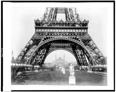 Base of Eiffel Tower, with statues in foreground and Trocadero Palace in background, Paris Exposition, 1889 LCCN92519639 photo