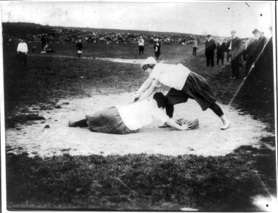 Baseball - New York Female Giants- Miss Schnall, catcher, and Miss Slachu with hands on home plate LCCN2004679530