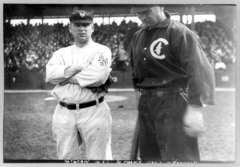 Baseball players John J. McGraw of N.Y. and Frank Chance of Chicago National League baseball, standing beside each other on baseball field LCCN89714138