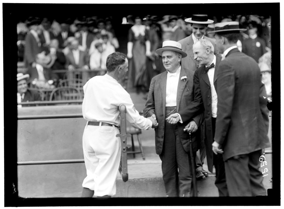 BASEBALL, PROFESSIONAL. CHAMP CLARK SHAKING HANDS WITH CLARK GRIFFITH LCCN2016863956
