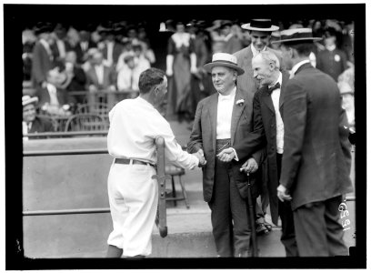 BASEBALL, PROFESSIONAL. CHAMP CLARK SHAKING HANDS WITH CLARK GRIFFITH LCCN2016863956