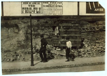 15 year old driver of oil wagon and his 10 year old helper. LOC nclc.05094