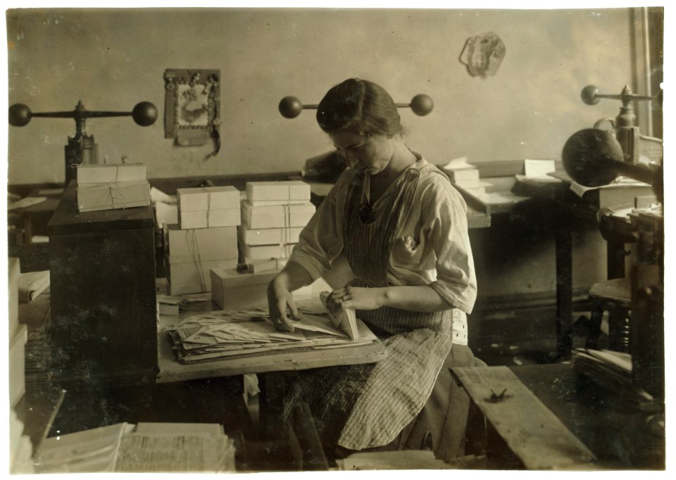 15-year old girl at her old job packing the finished envelopes. Embossing shop of Harry C. Taylor, 61 Court Street. LOC nclc.05166