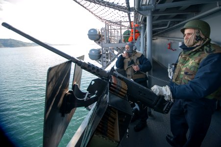 150123-N-RU971-031 - PO2 Kyle Shields mans M2 machine gun aboard USS Bonhomme Richard (LHD-6)