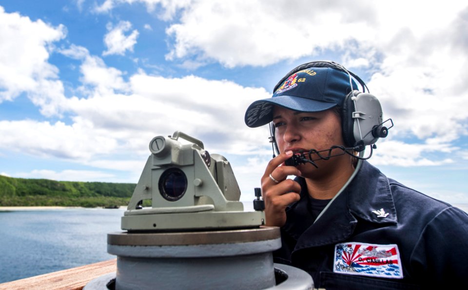 150810-N-XM324-077 - PO3 Christina Casillas speaks through a sound-powered telephone aboard USS Fitzgerald