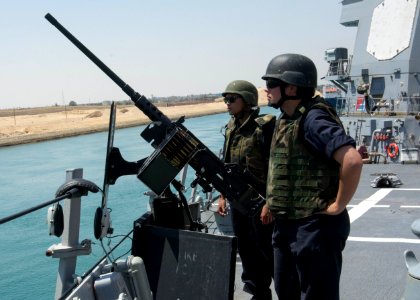 160629-N-CL027-049 - PO2 Ariana Freidrichs mans M2 machine gun aboard USS Mason (DDG-87)
