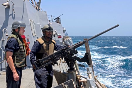170412-N-NB178-035 - U.S. Navy sailors man M2 machine gun aboard USS Truxton (DDG-103)