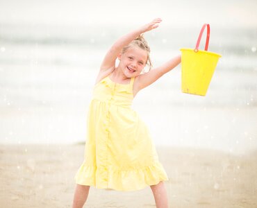 Kid yelow beach photo