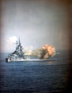 USS Idaho (BB-42) Bombarding Okinawa with her 14in guns, 1 April 1945. Photographed from USS West Virginia (BB-48) (50249160198) photo