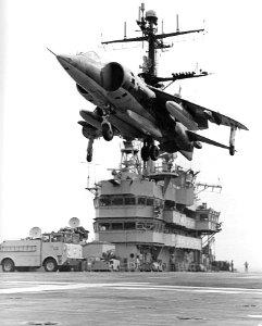 AV-8A of VMA-513 hovering over USS Guam (LPH-9) 1972