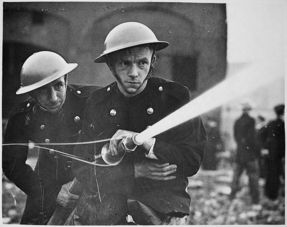 Over 500 firemen and members of the London Auxiliary Fire Fighting Services, including many women, combined in a war ex - NARA - 541892