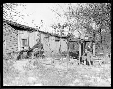 Rear view of the Glandon home at Bridges Chapel near Loyston, Tennessee. The children have shown considerable... - NARA - 532690