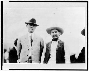 Red Lopez, Mexican insurrecto leader (right) and M.J. Brennan of Atlanta (left), posed standing, half-length LCCN97508884 photo