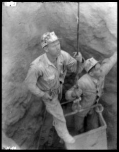 Shaftmen coming out of test shaft at Norris Dam site. - NARA - 532670