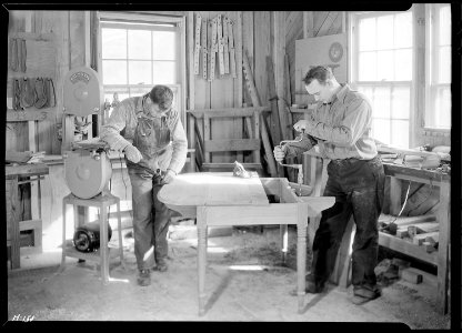 Shop of the Woodcrafters and Carvers, Gatlinburg, Tennessee. Dick Whaley, Manager, and Charley Huskey carry on this... - NARA - 532770 photo