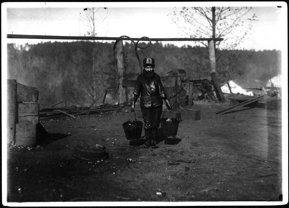 Shorpy, a greaser on the tipple at Bessie Mine, Alabama. Carries two heavy pails of grease and is often in danger... - NARA - 523362