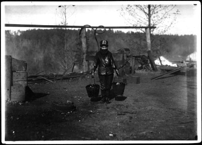 Shorpy, a greaser on the tipple at Bessie Mine, Alabama. Carries two heavy pails of grease and is often in danger... - NARA - 523362