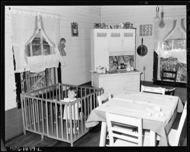 Baby of Luther Walker, miner, the Walker family consisting of two adults and baby live in a three room house for... - NARA - 540810