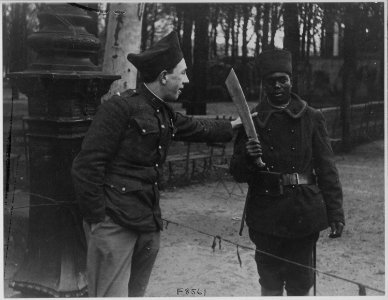 American in French Foreign Legion jokes with Sengalese Guard. Moyet, a member of the French Foreign . . . - NARA - 533555 photo