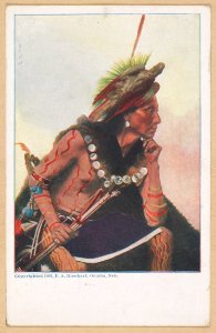American Indian, seated, holding bow and arrow, wearing body paint and a bird headress LCCN2016653223