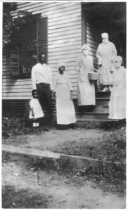 American Red Cross canteens, United States. Taking food to the (African American) family all down w . . . - NARA - 533586