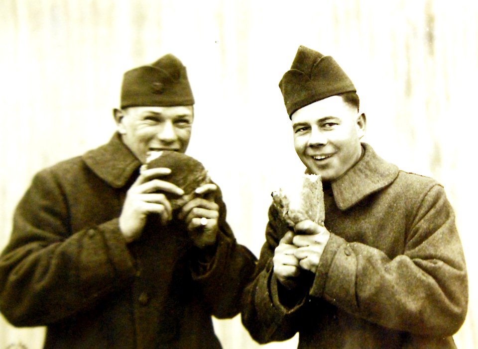 American soldiers eating bread in front of a bakery, Is-sur-Tille (Cote d’Or), France, 1919 (32938562612) photo