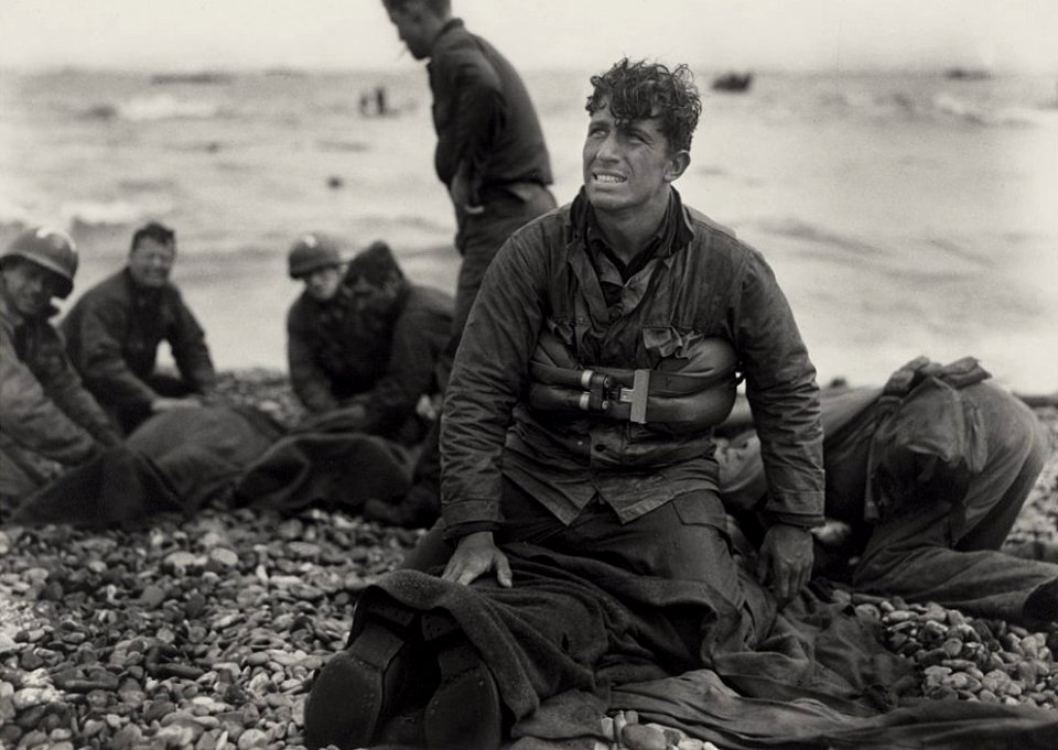 American soldiers recover the dead after D-Day